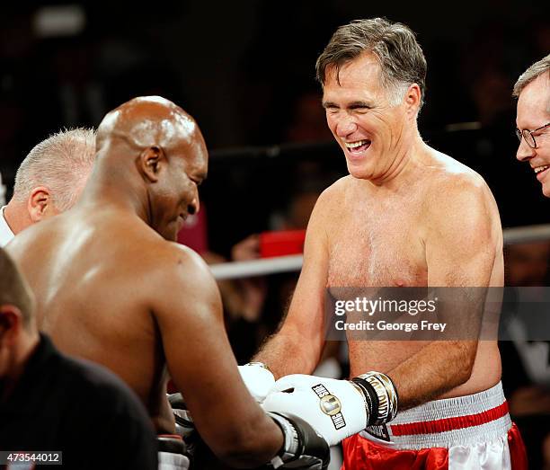 Mitt Romney and Evander Holyfield meet at center ring before a charity boxing event on May 15, 2015 in Salt Lake City, Utah.The event was held to...