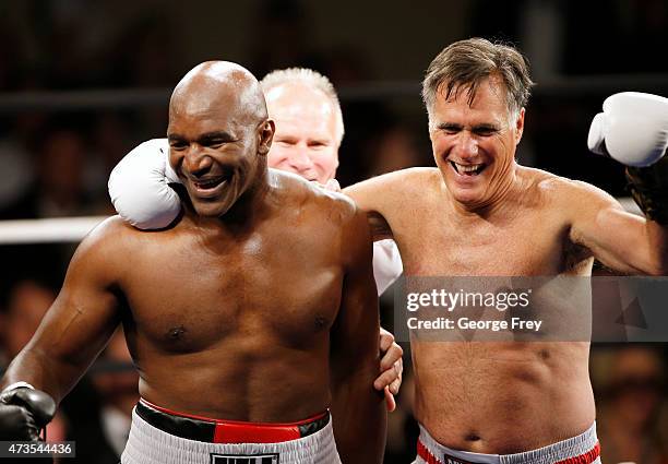 Evander Holyfield celebrates his win over Mitt Romney during a charity boxing event on May 15, 2015 in Salt Lake City, Utah. The event was held to...