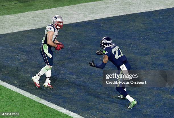 Julian Edelman of the New England Patriots catches a touchdown pass over Tharold Simon of the Seattle Seahawks in Super Bowl XLIX February 1, 2015 at...