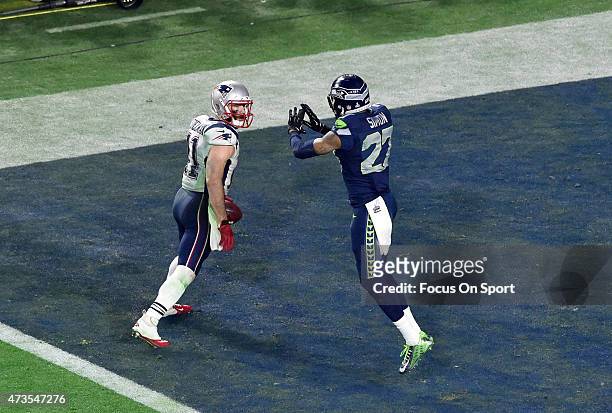 Julian Edelman of the New England Patriots catches a touchdown pass over Tharold Simon of the Seattle Seahawks in Super Bowl XLIX February 1, 2015 at...