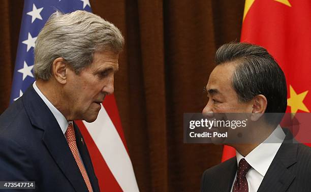 Secretary of State John Kerry speaks with Chinese Foreign Minister Wang Yi prior to their meeting on May 16, 2015 in Beijing, China. Kerry was to...