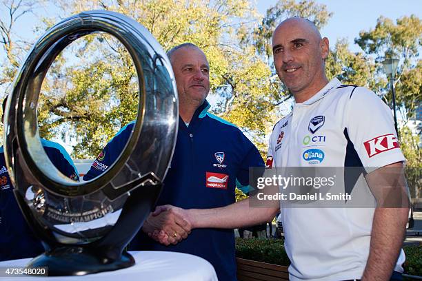 Sydney FC Head Coach, Graham Arnold and Melbourne Victory Head Coach, Kevin Muscat shake hands during the A-League Grand Final press conference at...