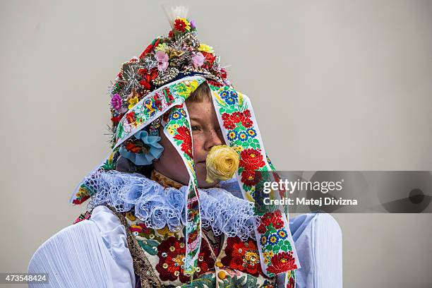 Twelve-year-old Frantisek Libosvar dressed as a girl and with a rose in his mouth leads the royal procession during Ride of the Kings as part of...