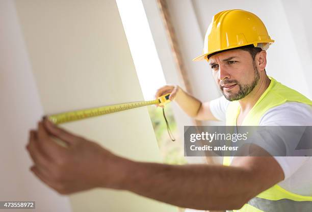 Builders Using Measure 16,139 Construction Measure Stock Photos, High-Res Pictures, and Images ...