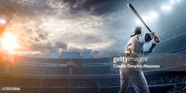 baseball player in stadium - baseball bat stock pictures, royalty-free photos & images