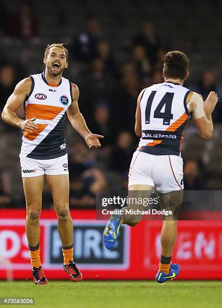 Joel Patfull of the Giants celebrates a goal with Tomas Bugg of the Giants during the round seven AFL match between the Carlton Blues and the Greater...