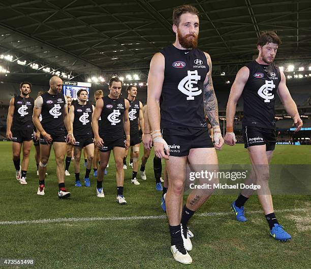 Zach Tuohy of the Blues and Sam Rowe of the Blues walk off after defeat during the round seven AFL match between the Carlton Blues and the Greater...