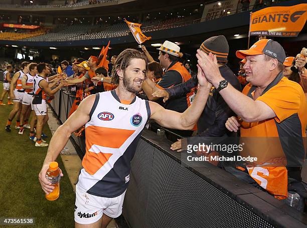 Callan Ward of the Giants celebrates the win with fans during the round seven AFL match between the Carlton Blues and the Greater Western Sydney...