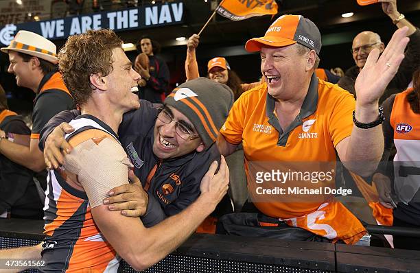 Adam Kennedy of the Giants celebrates the win with fans during the round seven AFL match between the Carlton Blues and the Greater Western Sydney...