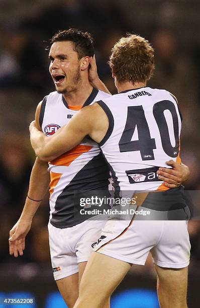 Zachary Williams of the Giants celebrates a goal Adam Kennedy during the round seven AFL match between the Carlton Blues and the Greater Western...