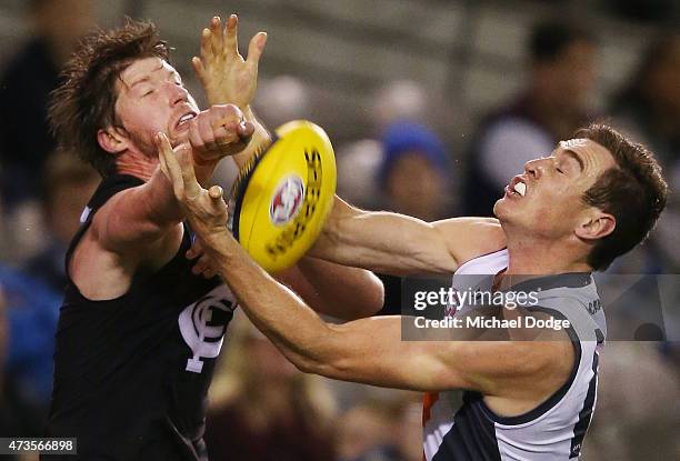 Jeremy Cameron of the Giants competes for the ball against Sam Rowe of the Blues during the round seven AFL match between the Carlton Blues and the...