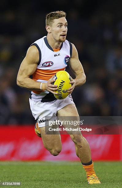 Devon Smith of the Giants runs with the ball during the round seven AFL match between the Carlton Blues and the Greater Western Sydney Giants at...