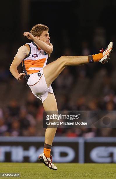 Adam Kennedy of the Giants kicks the ball during the round seven AFL match between the Carlton Blues and the Greater Western Sydney Giants at Etihad...