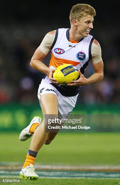 Lachie Whitfield of the Giants runs with the ball during the round seven AFL match between the Carlton Blues and the Greater Western Sydney Giants at...