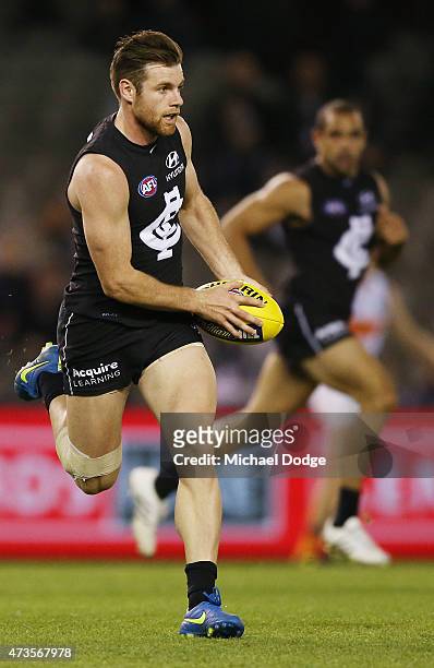Sam Docherty of the Blues runs with the ball during the round seven AFL match between the Carlton Blues and the Greater Western Sydney Giants at...