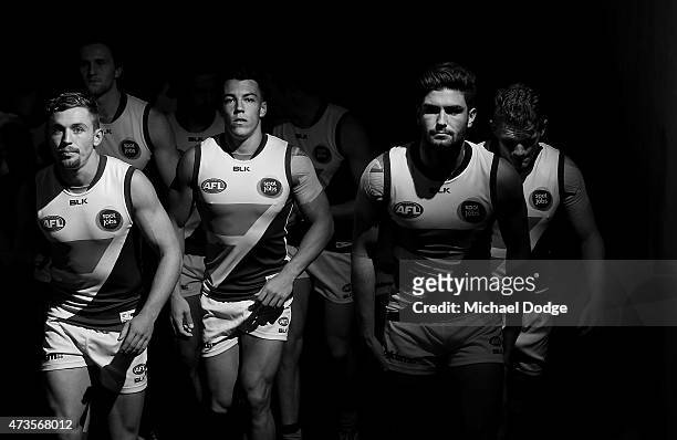 Devon Smith Dylan Shiel and Tomas Bugg of the Giants lead the team out during the round seven AFL match between the Carlton Blues and the Greater...