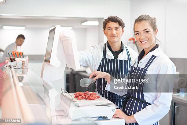 young apprentice butchers - butcher stock pictures, royalty-free photos & images