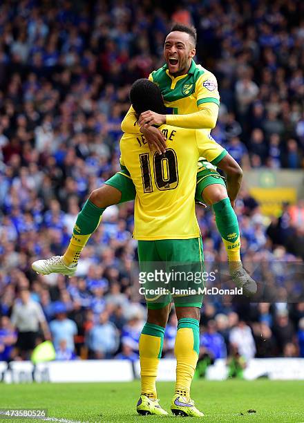 Cameron Jerome of Norwich City celebrates with team mate Nathan Redmond as he scores their third goal during the Sky Bet Championship Playoff semi...