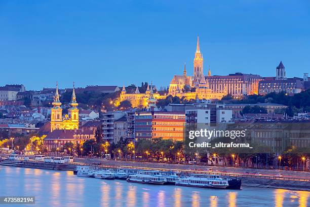 budapest view of matthias church and fisherman's bastion at dusk - hungary hotel stock pictures, royalty-free photos & images