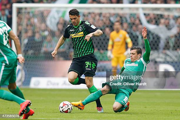 Zlatko Junuzovic of Bremen and Granit Xhaka of Moenchengladbach compete for the ball during the First Bundesliga match between SV Werder Bremen and...