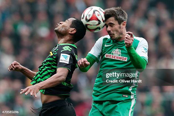 Fin Bartels of Bremen and Raffael of Moenchengladbach compete for the ball during the First Bundesliga match between SV Werder Bremen and Borussia...