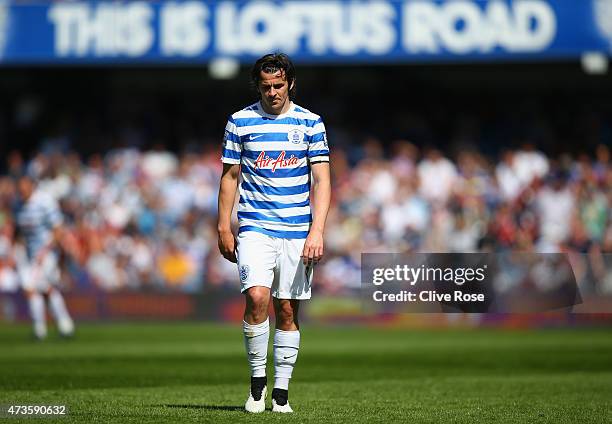 Dejected Joey Barton of QPR looks to the ground during the Barclays Premier League match between Queens Park Rangers and Newcastle United at Loftus...