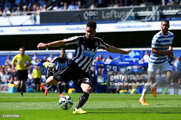 Emmanuel Riviere of Newcastle United scores the opening goal during the Barclays Premier League match between Queens Park Rangers and Newcastle...