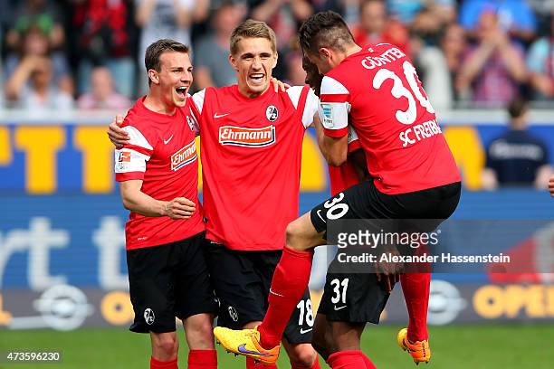 Nils Petersen of Freiburg celebrates victory with his team mates after the Bundesliga match between Sport Club Freiburg and FC Bayern Muenchen at...