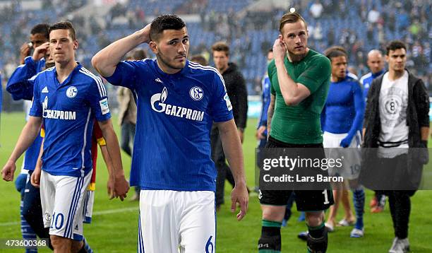 Julian Draxler of Schalke 04, Sead Kolasinac of Schalke 04 and goalkeeper Ralf Fahrmann of Schalke 04 are seen with team mates after the Bundesliga...