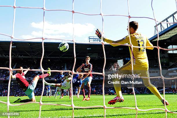 Leon Osman of Everton scores their first goal past Adrian of West Ham during the Barclays Premier League match between West Ham United and Everton at...