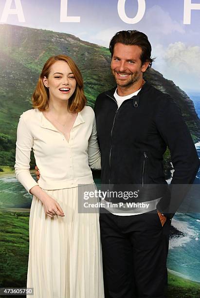 Emma Stone and Bradley Cooper attend a screening of 'Aloha' at Soho Hotel on May 16, 2015 in London, England.