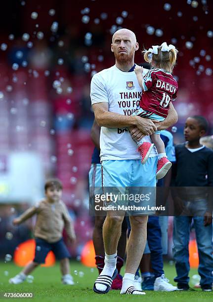 James collins of West Ham holds his daughter after the Barclays Premier League match between West Ham United and Everton at Boleyn Ground on May 16,...