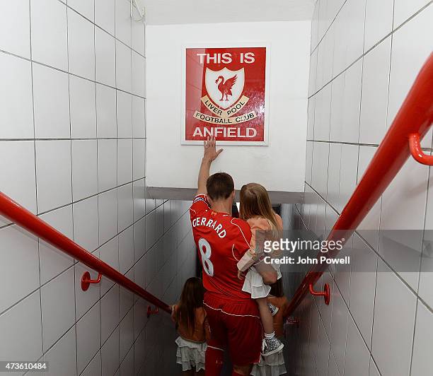 Steven Gerrard of Liverpool touches the famous sign before the Barclays Premier League match between Liverpool and Crystal Palace at Anfield on May...