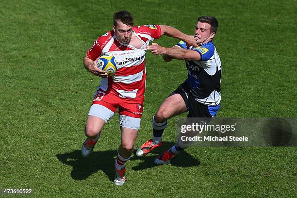 George Ford of Bath challenges Brendan Macken of Gloucester during the Aviva Premiership match between Bath Rugby and Gloucester Rugby at the...