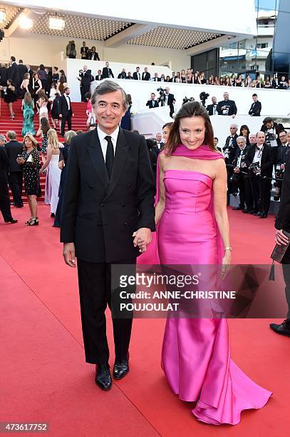 Former French minister Philippe Douste-Blazy and his wife Marie-Yvonne pose as they arrive for the screening of the film "Mia Madre" at the 68th...
