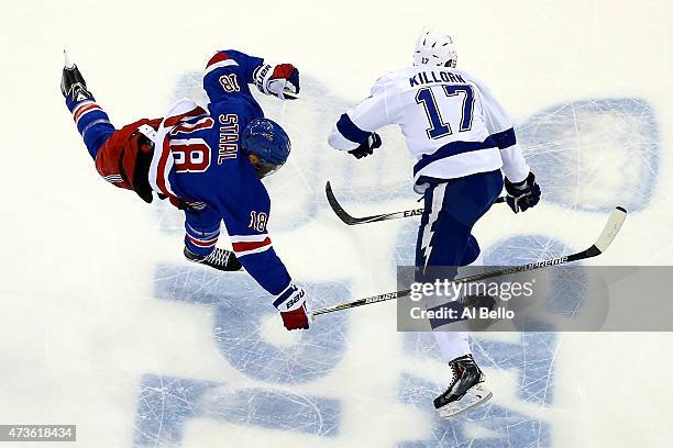 Alex Killorn of the Tampa Bay Lightning checks Marc Staal of the New York Rangers in the first period of Game One of the Eastern Conference Finals...