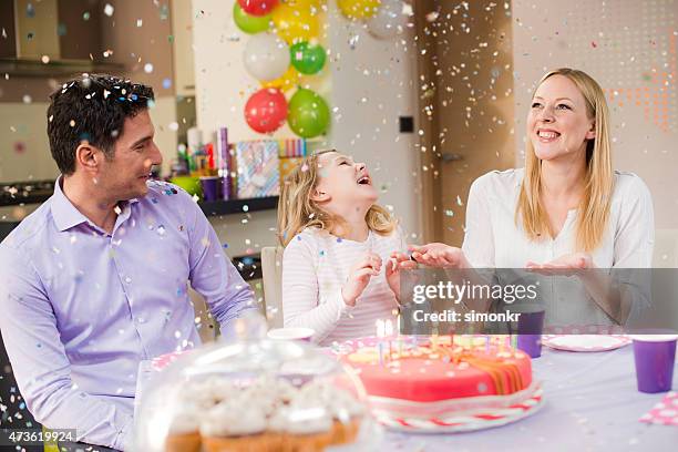 family celebrating girl's birthday - 40 birthday stock pictures, royalty-free photos & images