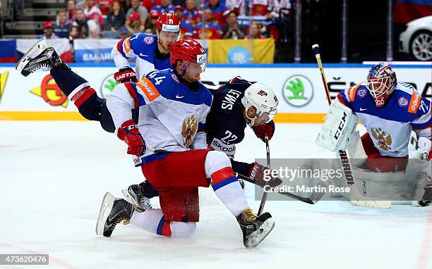 Trevor Lewis of USA and Yegor Yakovlev of Russia battle for the puck during the IIHF World Championship semi final match between USA and Russia at O2...