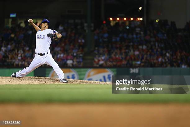 Kyuji Fujikawa of the Texas Rangers throws against the Cleveland Indians in the sixth inning at Globe Life Park in Arlington on May 15, 2015 in...