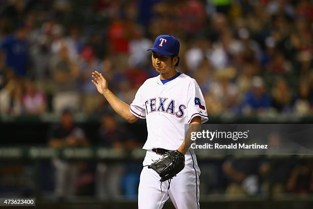 Kyuji Fujikawa of the Texas Rangers throws against the Cleveland Indians in the sixth inning at Globe Life Park in Arlington on May 15, 2015 in...