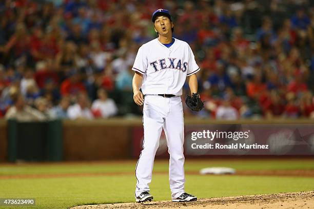 Kyuji Fujikawa of the Texas Rangers throws against the Cleveland Indians in the sixth inning at Globe Life Park in Arlington on May 15, 2015 in...