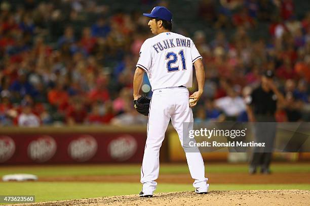 Kyuji Fujikawa of the Texas Rangers throws against the Cleveland Indians in the sixth inning at Globe Life Park in Arlington on May 15, 2015 in...