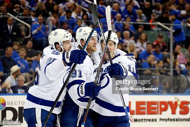 Ondrej Palat celebrates with Steven Stamkos, and Nikita Kucherov of the Tampa Bay Lightning after scoring a goal in the third period against the New...