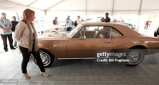 General Motors CEO Maty Barra looks at the first Camaro ever built at a Camaro Museum on Detroit's Belle Isle before GM officially reveals the new...