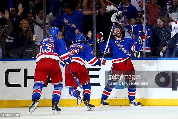 Dominic Moore of the New York Rangers celebrates the game-winning goal in the third period against the Tampa Bay Lightning in Game One of the Eastern...