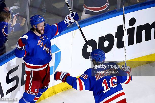 Dominic Moore of the New York Rangers celebrates scoring the game-winning goal in the third period against the Tampa Bay Lightning in Game One of the...