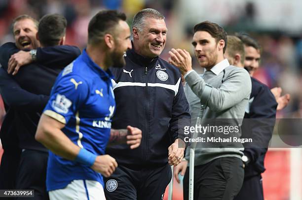 Marcin Wasilewski of Leicester City celebrates with Nigel Pearson, manager of Leicester City during the Barclays Premier League match between...
