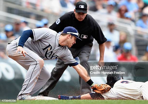 Evan Longoria of the Tampa Bay Rays catches Brian Dozier of the Minnesota Twins stealing third base during the fifth inning of the game on May 16,...