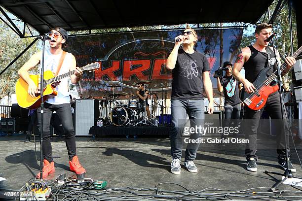 Musician Mark Hoppus of Blink-182 performs onstage with Alex Gaskarth and Zack Merrick of All Time Low at the KROQ Weenie Roast Y Fiesta 2015 at...