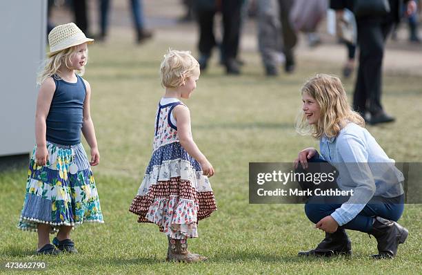 Lady Louise Windsor plays with Isla Phillips and Savannah Phillips at the Royal Windsor Horse show in the private grounds of Windsor Castle on May...